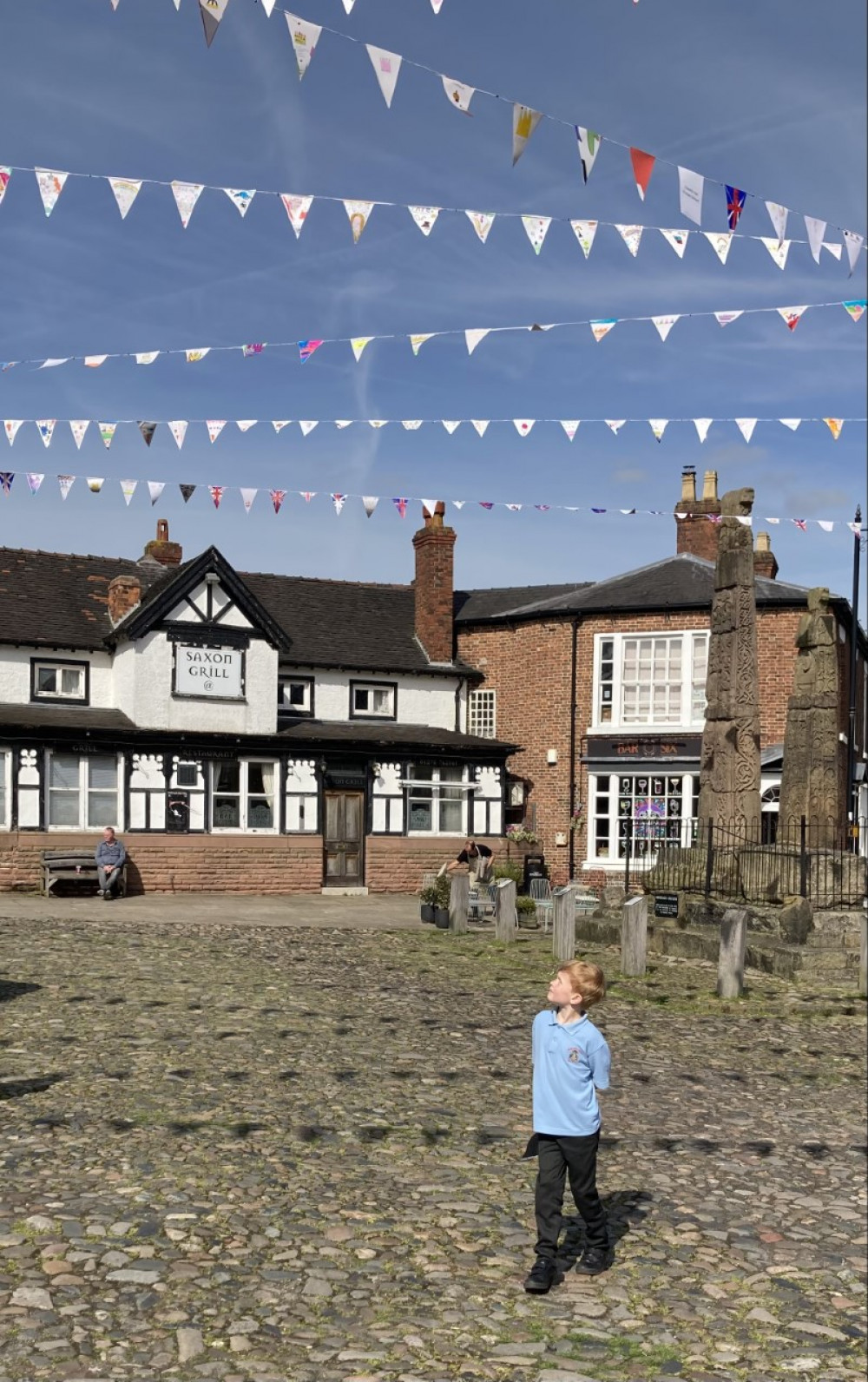 Sandbach's Cole Birchall spotting his hand-decorated flag as part of the town's Coronation display by local primary schools. (Photo: Arnie Laing, Sandbach Co-op Member Pioneer) 