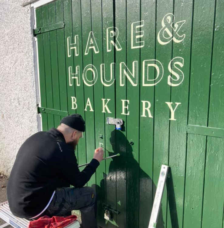 Nick the sign painter adding one of the final touches