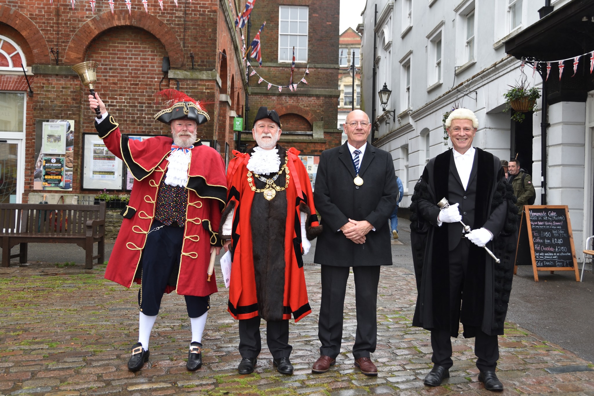 The Mayor of Bridport, Cllr Ian Bark, with town crier John Collingwood, Cllr Dave Bolwell and town clerk Will Austin (photo credit: Tim Russ) 