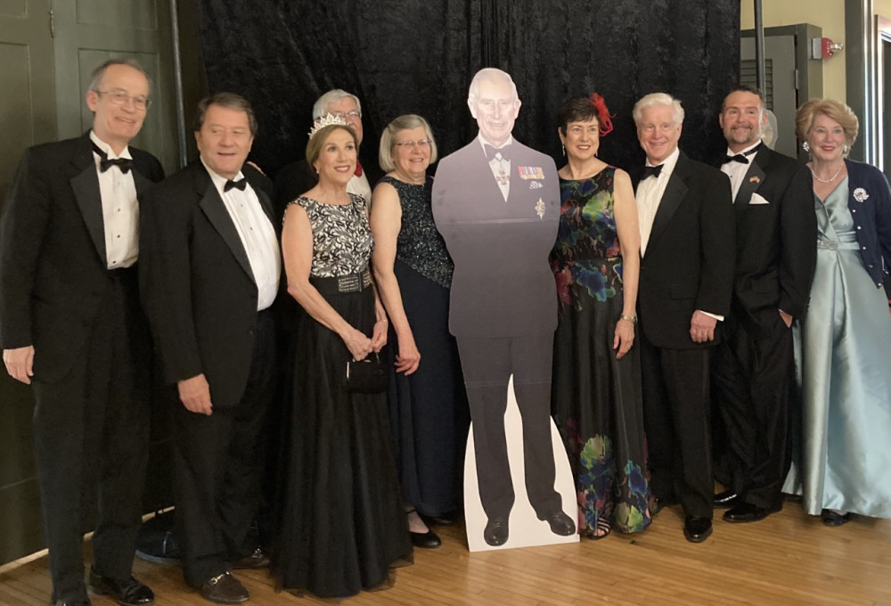 The Coronation Ball planning committee pose with a cut out of King Charles III (image supplied)