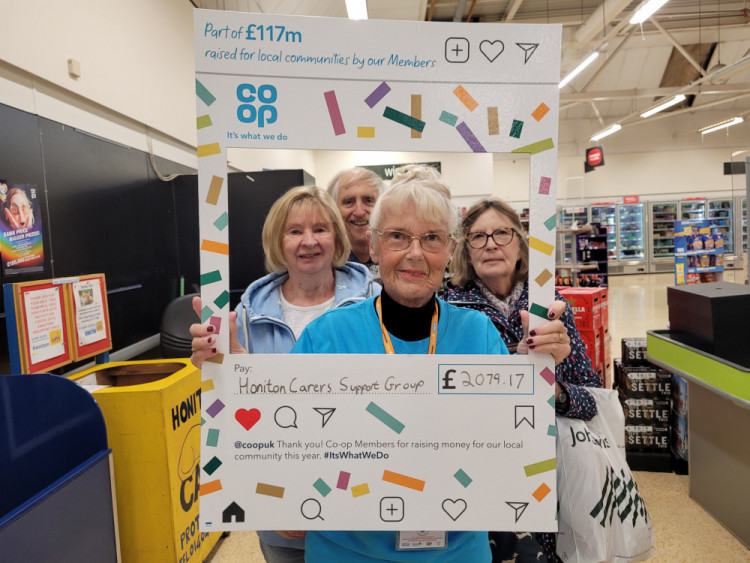 Winnie Cameron of Honiton Carers collecting a cheque from the Co-op (Winnie Cameron)