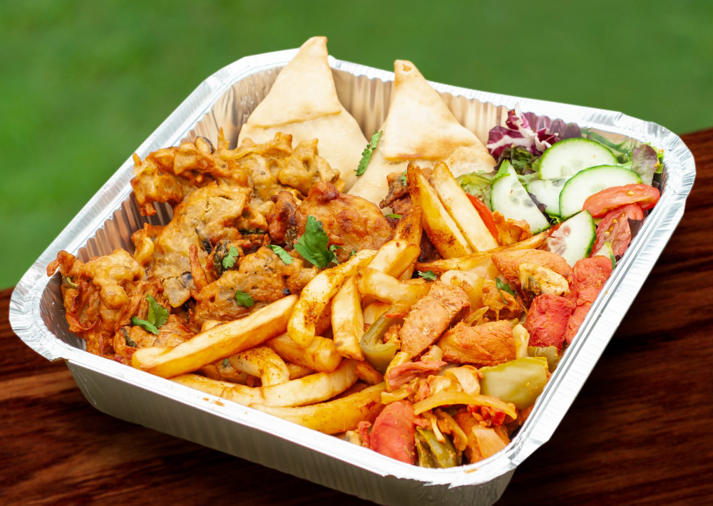 Suffolk Spice Fusion's mega feast box of chicken tikka, salad, naan, samosas and masala chips (Picture: Charlotte Jarvis-Smith)