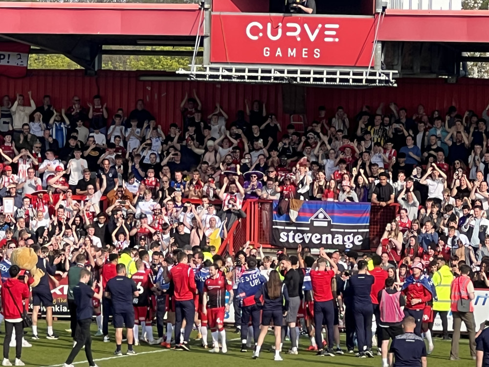 Stevenage retained/released list: Owen Rodbard gives his verdict on Steve Evans forthcoming squad for League One. PICTURE: The team and fans celebrate after beating Grimsby 2-0 to seal promotion on a never-to-be-forgotten afternoon at Broadhall Way. CREDIT: @laythy29