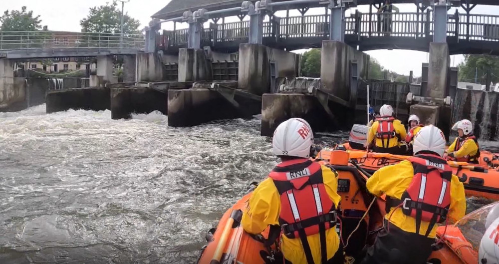 Both Teddington RNLI's lifeboats were on scene as two people were trapped against the Molesey Weir gates (Credit: Teddington RNLI)