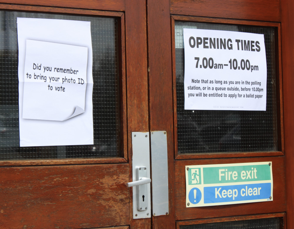 A voting ID reminder on the door of a polling station. (Image - Alexander Greensmith / Macclesfield Nub News)