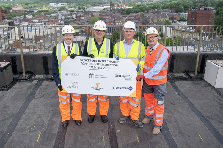 The milestone for the Stockport travel interchange was celebrated in a 'topping out' ceremony, featuring (left to right) Cllr Mark Hunter, Andy Burnham, Mark McNamee, and Antony Dillon (Image - Stockport Council)