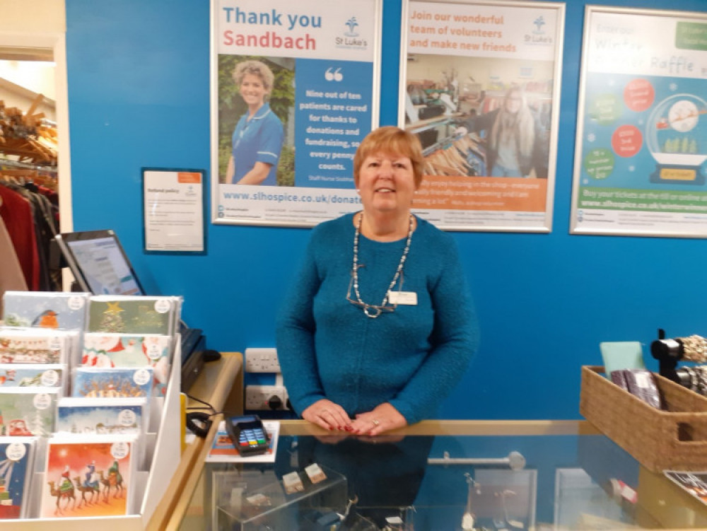 Choral singer, Pat Arnold from Elworth volunteers at St Luke's shop in Sandbach. (Photo: Sandbach Nub News) 