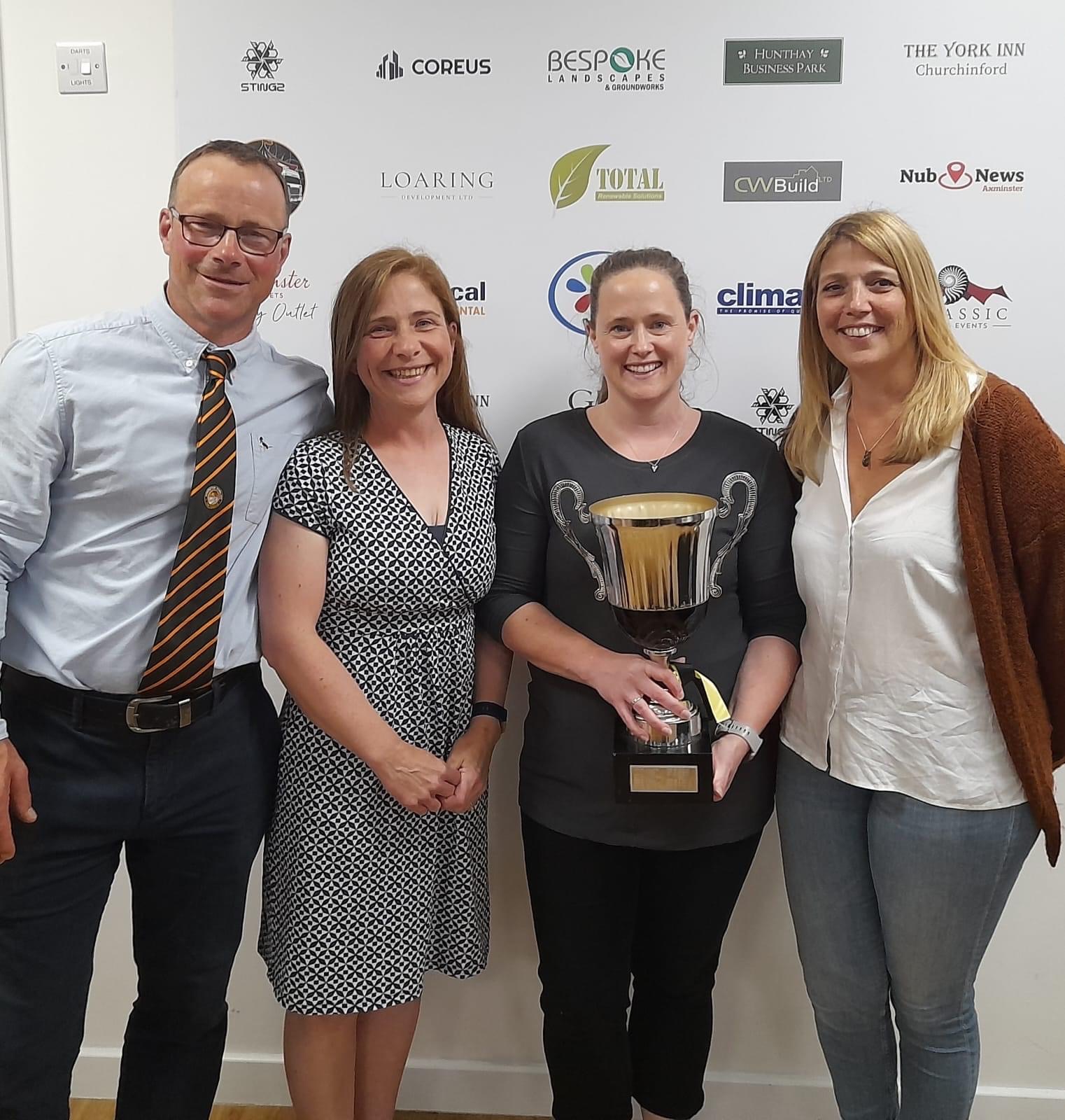 Chairman Andy Hurford pictured with Cubman of the Year Clare Herbert and volunteers Necki Page and Rachel Burrough