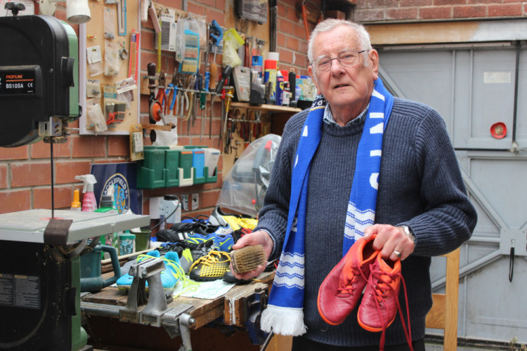 David Normington at his football boot workstation (Image - Alexander Greensmith / Stockport Nub News)