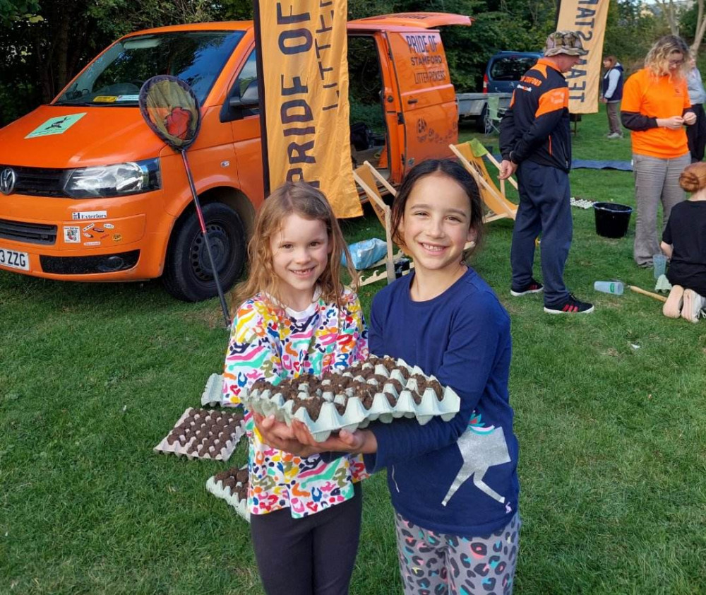 Edith and Zena with wildflower seed bombs, at the 2022 Festival.  Image credit: Ketton Green Festival. 