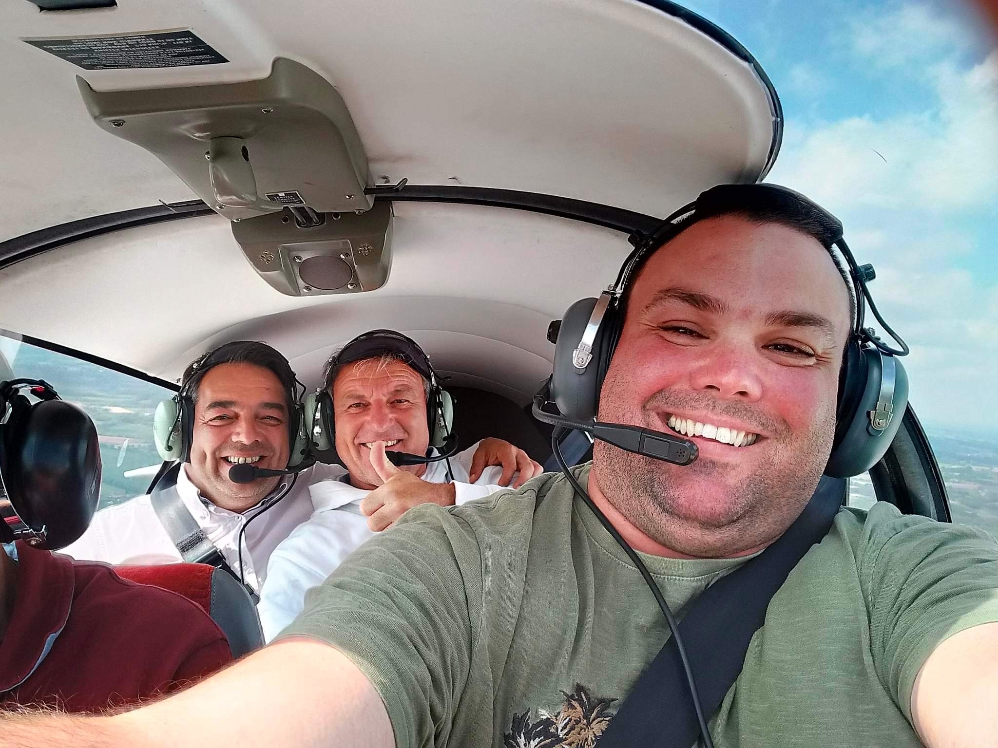 Cllr Monks, mayor David Juquin and Christophe Duhamel of Saint-James Council enjoy a plane ride