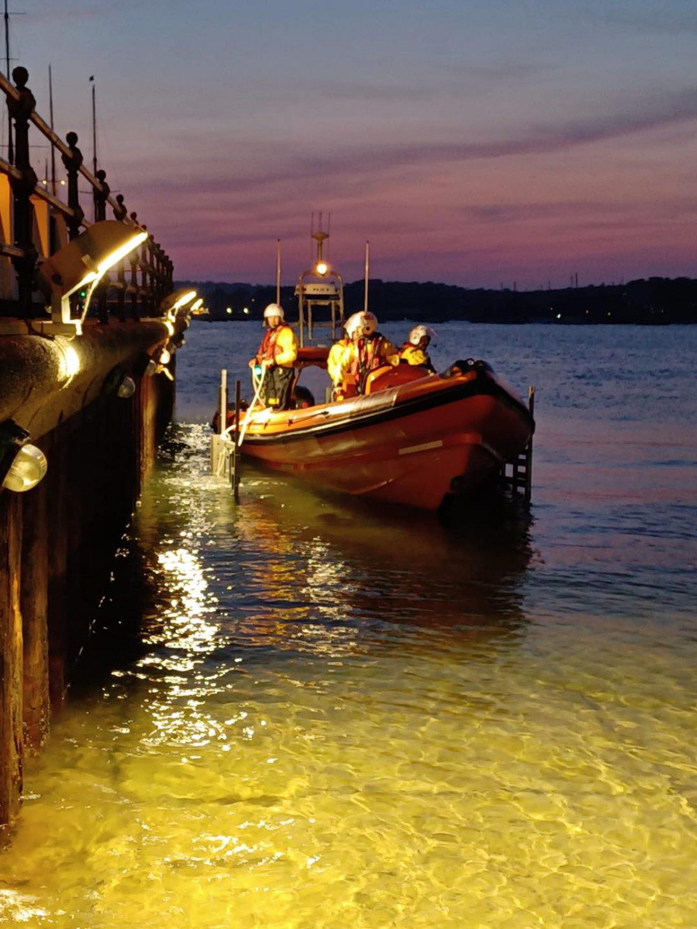 The team next to the Prince of Wales Pier (Image: Falmouth Lifeboat)