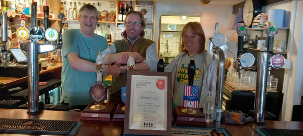 West Dorset CAMRA chairman Bruce Mead, The Woodman licensee Darren Moore and West Dorset CAMRA cider represenative Alex Bardswell (photo credit: Rich Gabe)