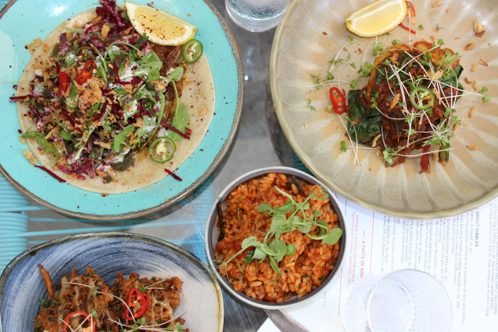 Dishes you can enjoy inside and out include crispy kale and onion bhajiya with spiced mango chutney (bottom), Tomato rice (centre), Beef chettinad with herb raita and summer kachumber salad (top left) and Meen Ghee roast is a white fish dish served with a rich tomato based, curry leaves, rainbow chard (top right). (Image - Alexander Greensmith / Macclesfield Nub News) 