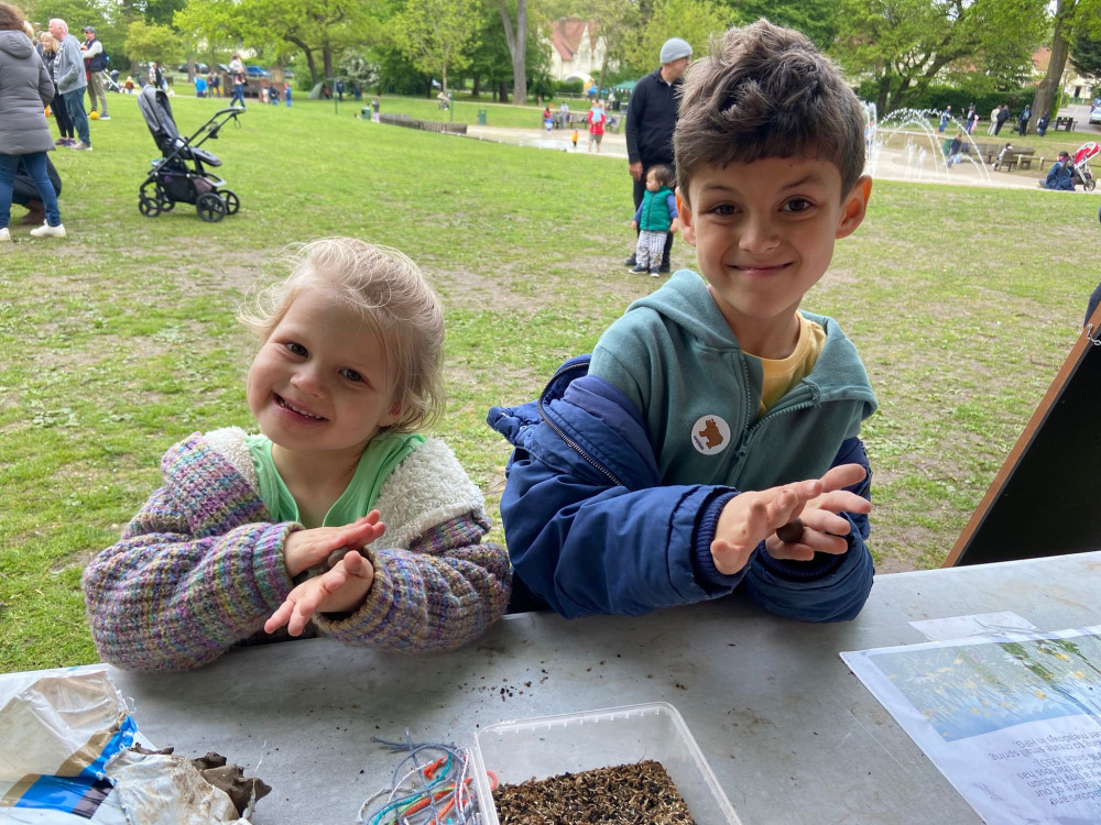 ‘Bee’ part of it! Busy bees making bee bombs in Howard Park, Letchworth. CREDIT: NHC