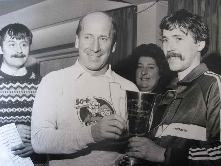 Bobby Charlton presents the Four Villages Half Marathon trophy in the '80s