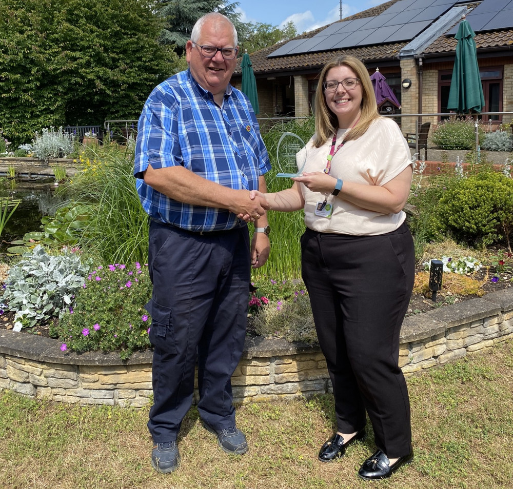 Peninsula star Kevin Widdick receives award from Helen Bloom -oh yes he did.. (Picture: St Elizabeth Hospice)