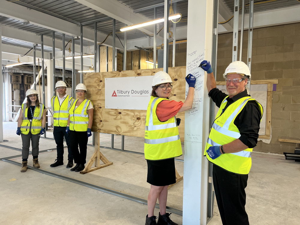 The steel signing is a symbolic milestone in the construction of Stepping Hill Hospital's new emergency and urgent care campus, due to be complete in March 2024 (Image - Stockport NHS Foundation Trust)