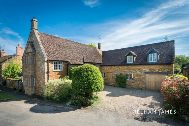 The property is a stunning L shaped home in Lyddington. Image credit: Pelham James. 