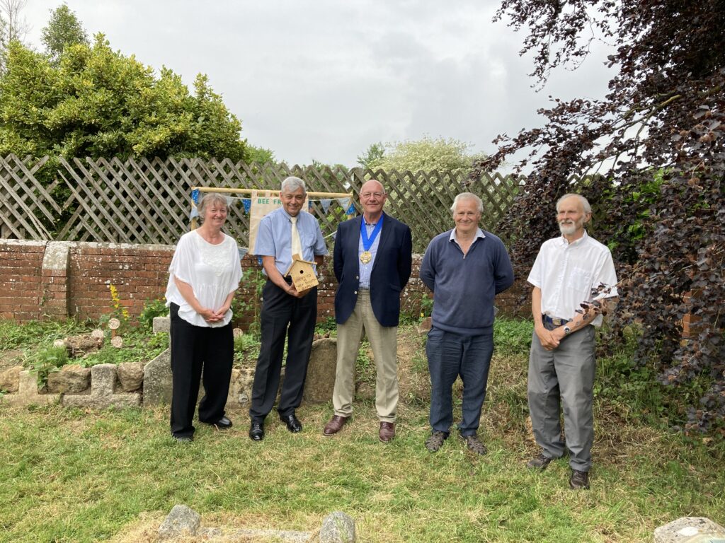 The Mayor of Bridport, Cllr Dave Bolwell, and those involved in creating the bee garden at Bradpole Church