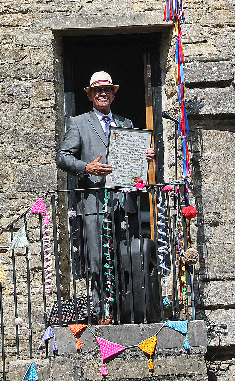 The Glove is Up! Lord of the Manor Jim Rowe is pictured with the ancient fayre charter