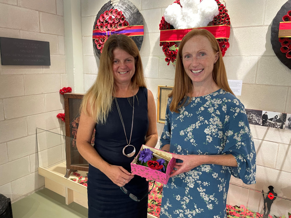 Amanda Shepard (left) with Victoria Martin and the vintage poppy box at The Poppy Factory