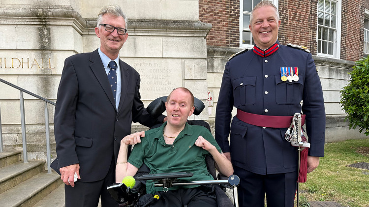 Iraq veteran Stephen Vause, a resident at Royal Star & Garter in Surbiton, attended an Armed Forces Day event at Kingston Council with Andrew Ranson, Deputy Lieutenant of Greater London, and Phil, who works at the Home (Credit: Royal Star & Garter)