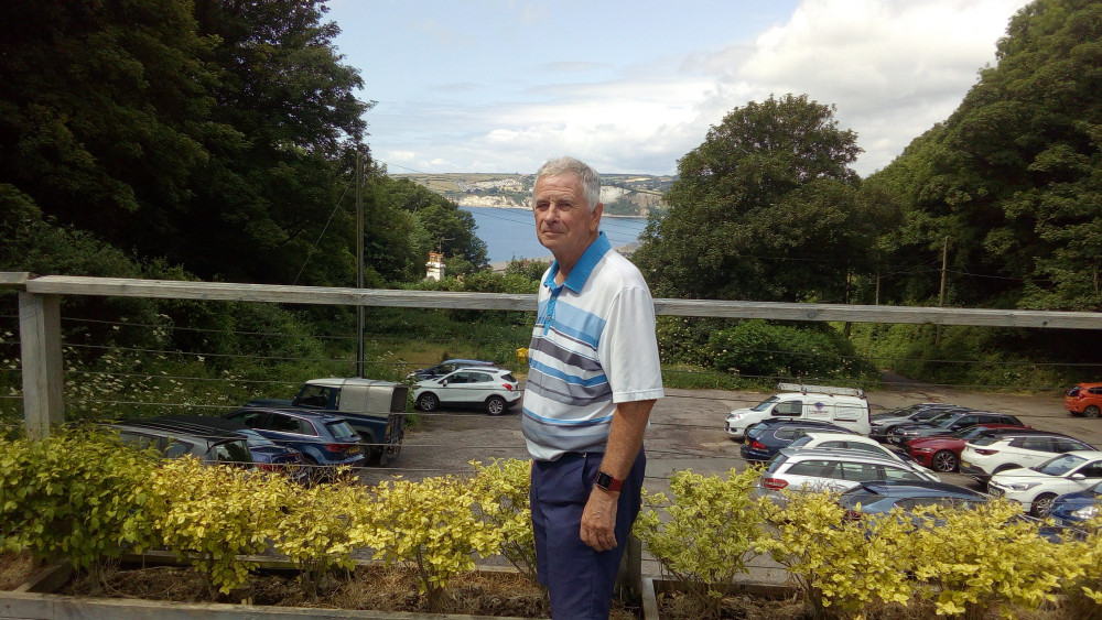 Masters champion Nigel Pritchard looking cool outside our clubhouse with Seaton Bay in the background