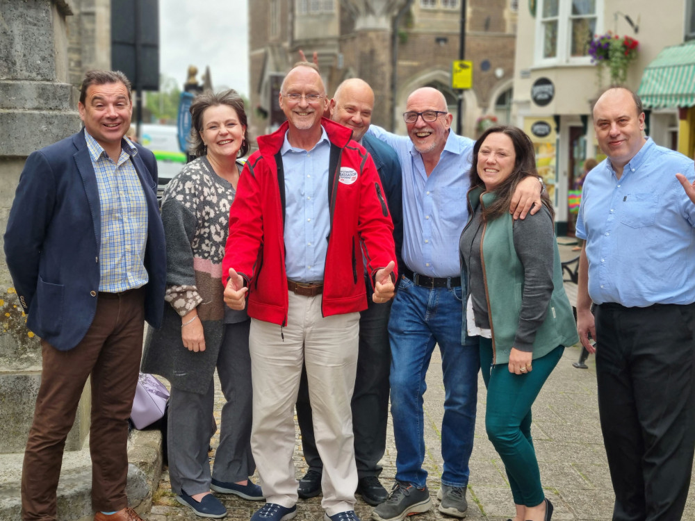 Steve Farnham, Carol, Philo Gordon, Nick Rawlings, Lisa Ryall, John Fiori, Lisa Cartwright, and Neil Strudwick from Dorchester BID celebrate the 'yes' vote