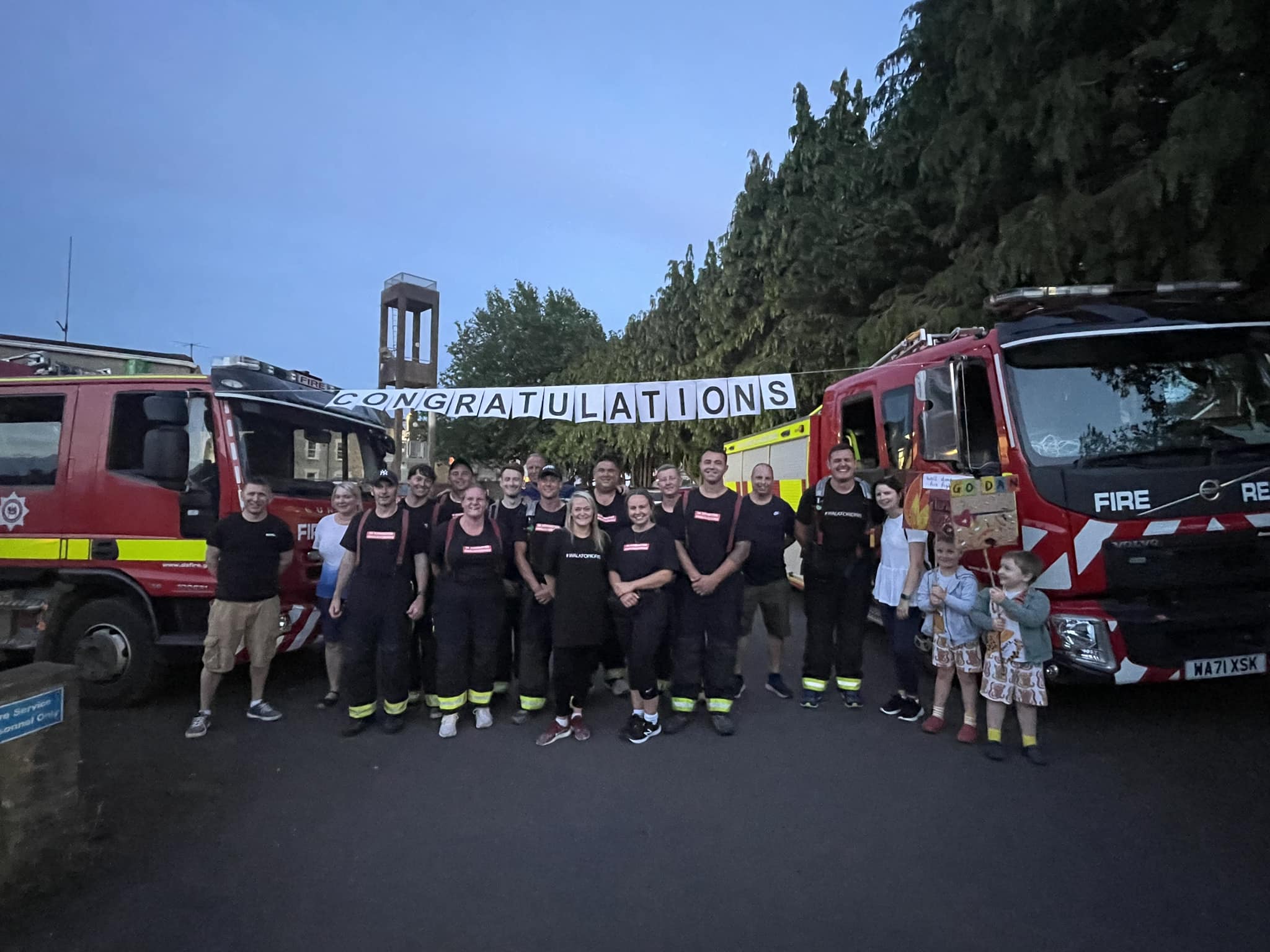 The Axminster firefighters are joined by supporters at the finish line