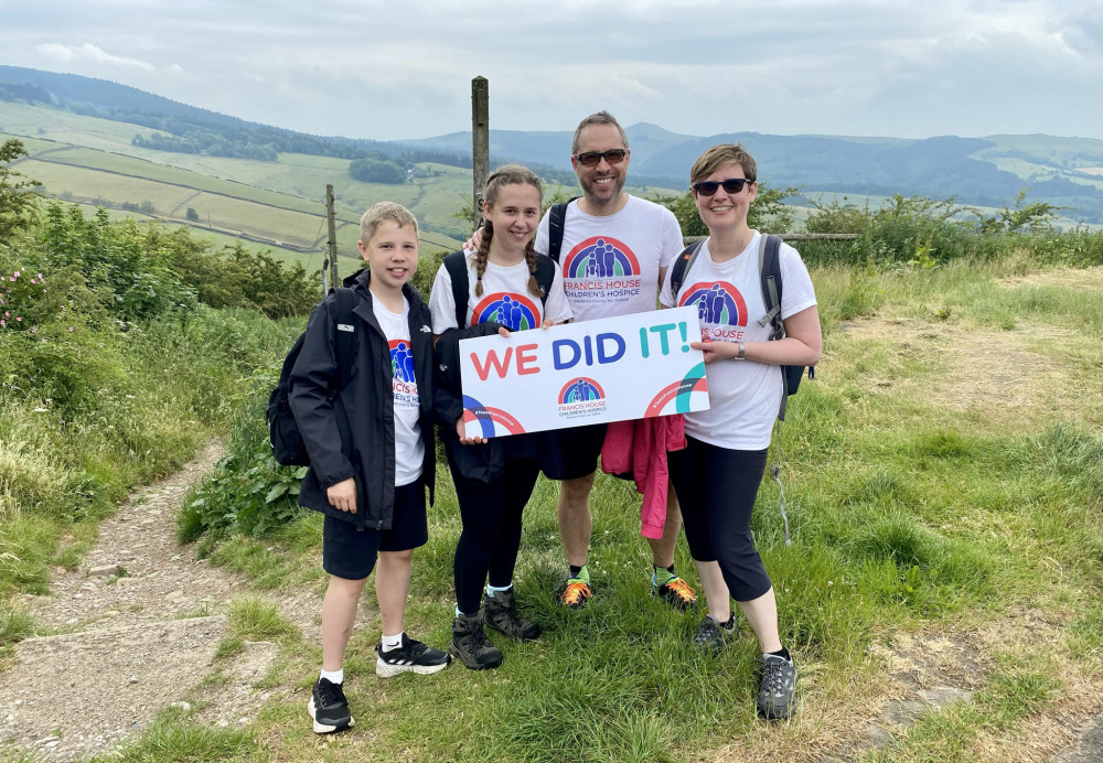 Paul Smith and Kate Unsworth with their children Daniel and Alice walked 13.6 mile in aid of Francis House Children's Hospice.