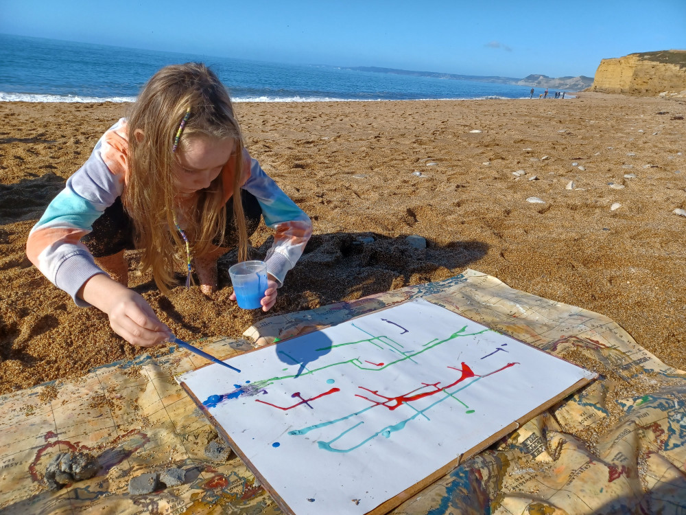 Children and families can enjoy a range of activities at National Trust sites including Hive Beach and Golden Cap this summer (photo credit: Elizabeth Flight, National Trust)