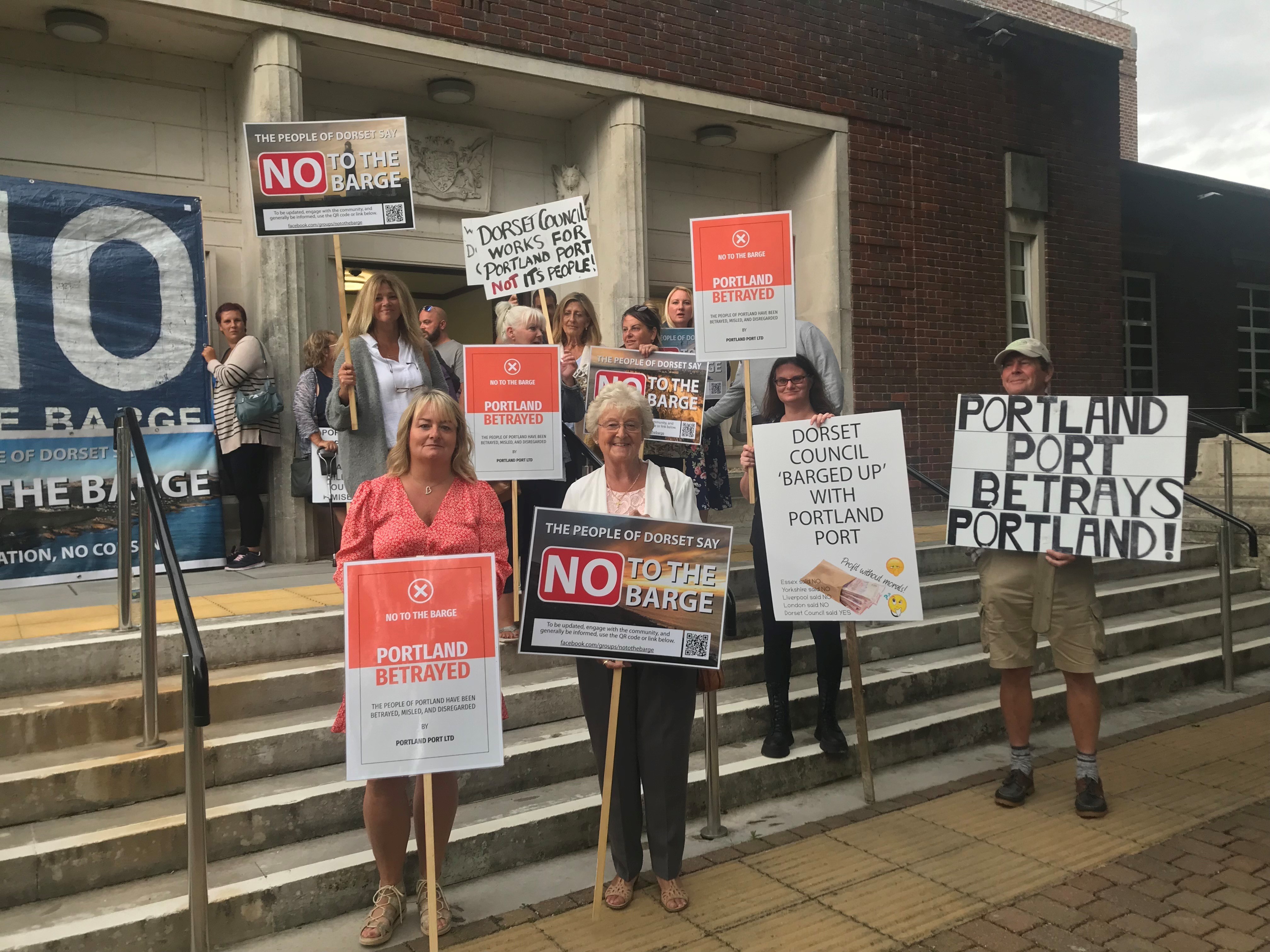 Protestors against the barge pictured outside County Hall on Thursday evening