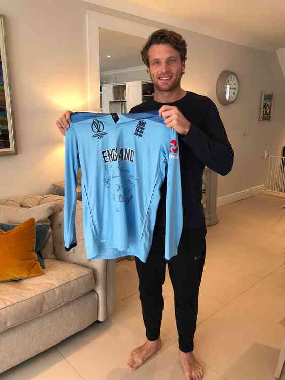 Jos Buttler with the shirt he is auctioning for charity