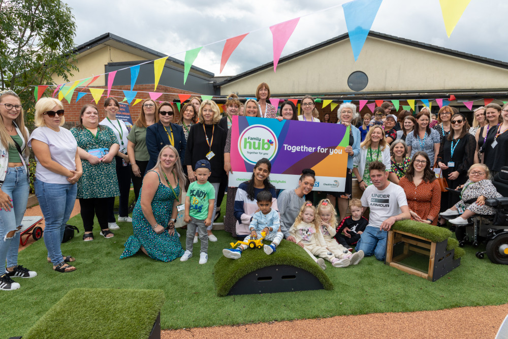 Staff from Cheshire East Council, NHS and community organisations, celebrate with families at the opening of Oak Tree Family Hub in Crewe (Cheshire East Council).