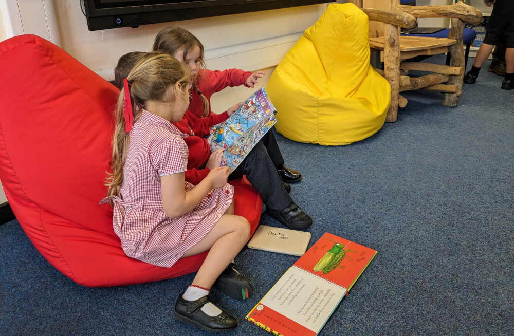 Reception children were amongst the first to try out the new library, which has over ten grand's worth of titles. 