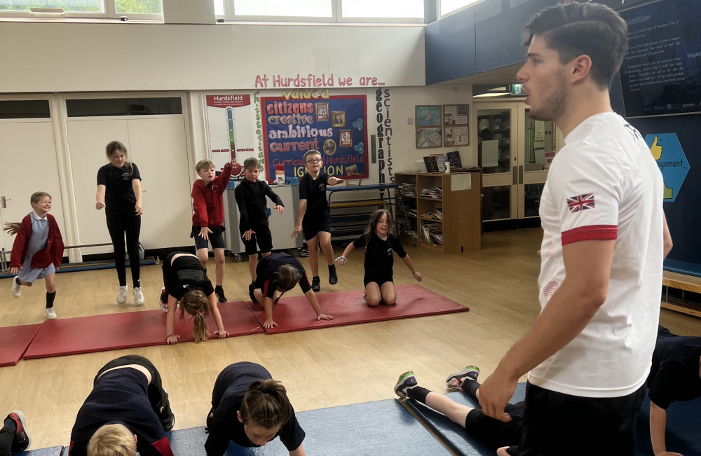 British tumbling gymnast Jay Paddock got classes moving at Hurdsfield Primary School in a day of activity. 