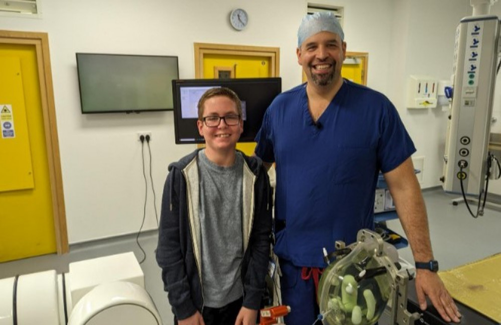 The Year 11 pupil pictured with Alder Hey's Mr Ellenbogen. 