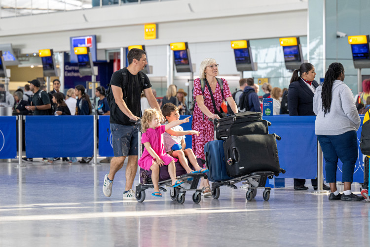 Families jetted off on holiday on what is the last day of school for many children in England and Wales on Friday (image via SWNS)