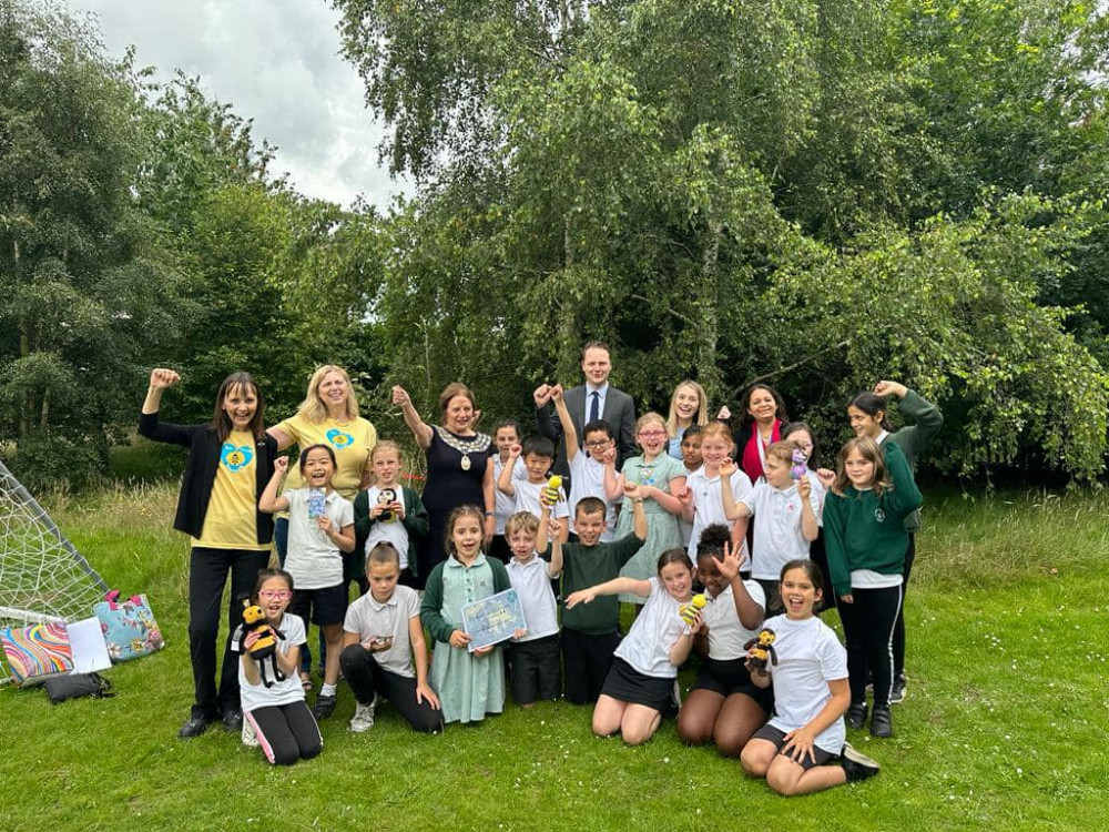 Pupils at St John's Primary School receive the Bee Friendly Kenilworth silver award (image via Cllr Alix Dearing)
