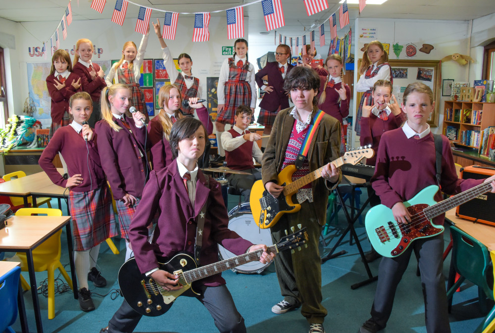 Dewey Finn and the pupils in the School of Rock (Image: Young Generation) 