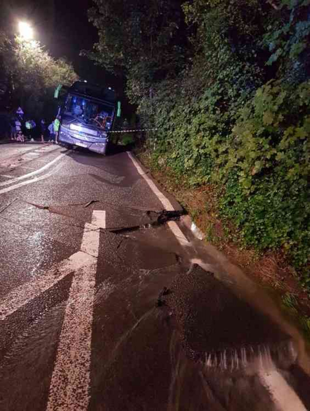 The hole caused by the burst water main on the A38 (Photo: Avon and Somerset Police)