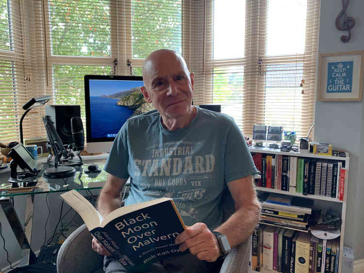 Author Rob Kail-Dyke at his desk with new book Black Moon Over Malvern