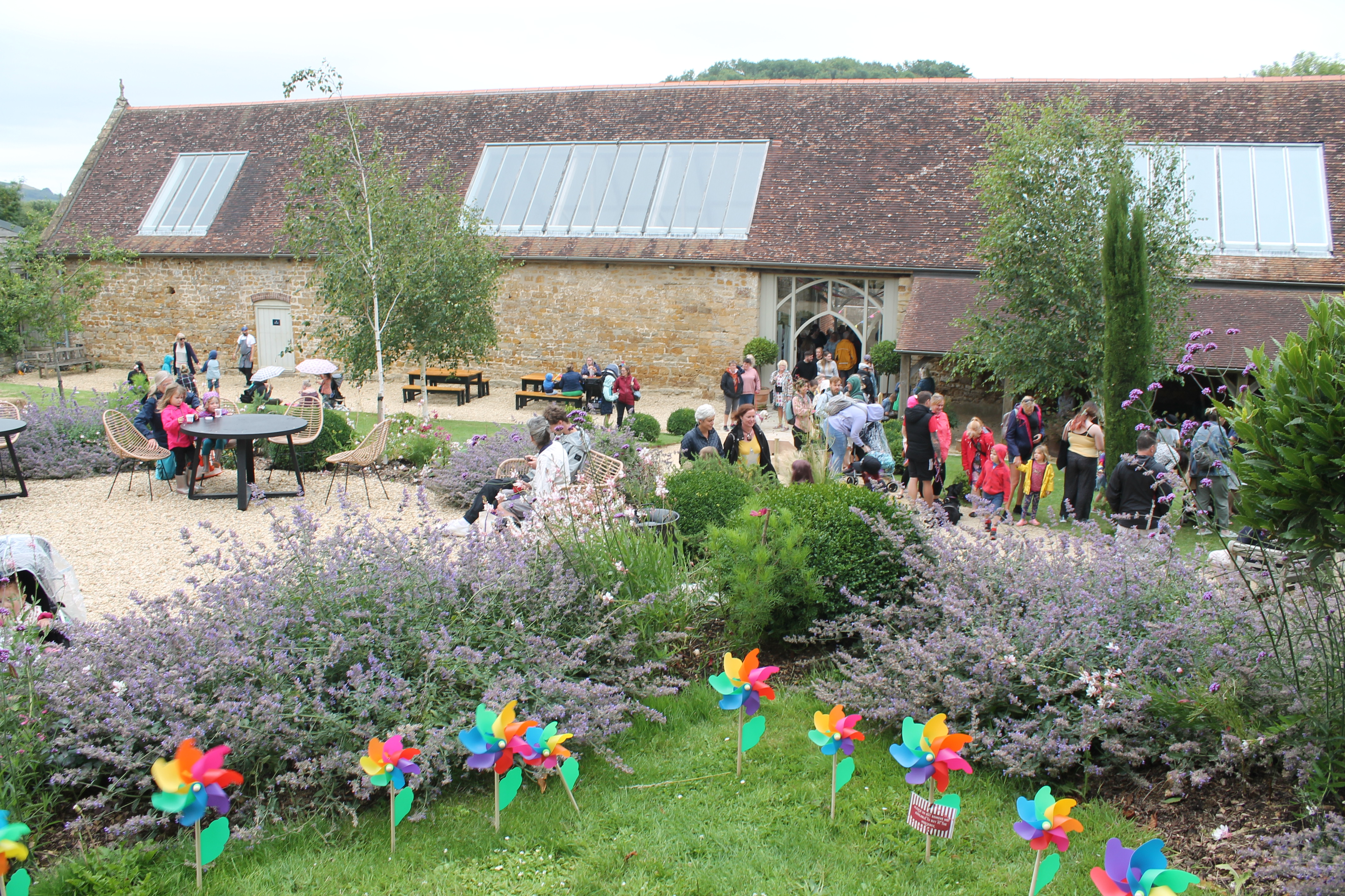 Crowds gathered in the Tithe Barn and garden at Symondsbury Estate