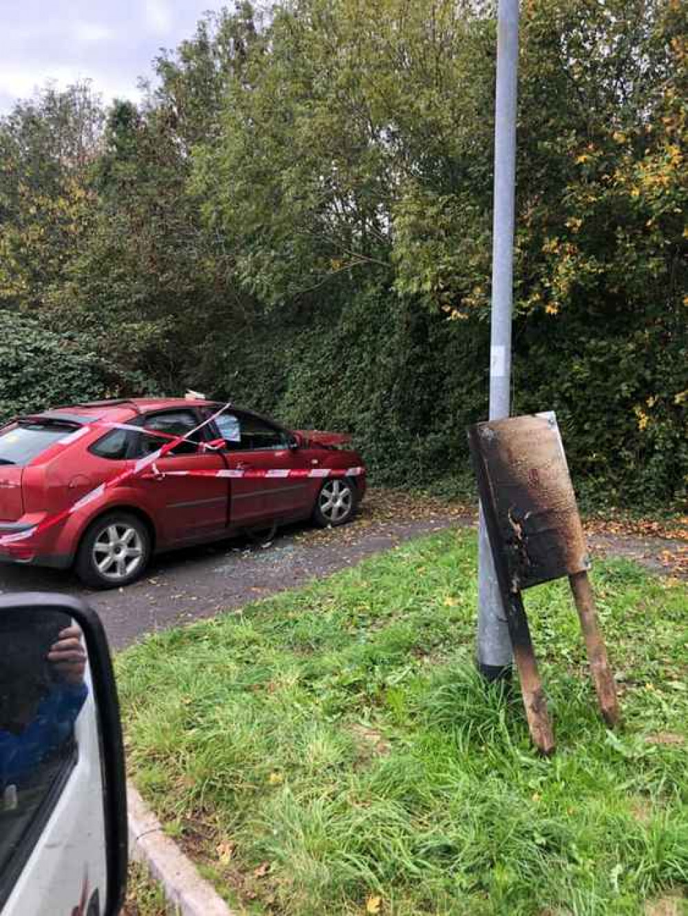 The Ford Focus and sign that it is believed were set alight