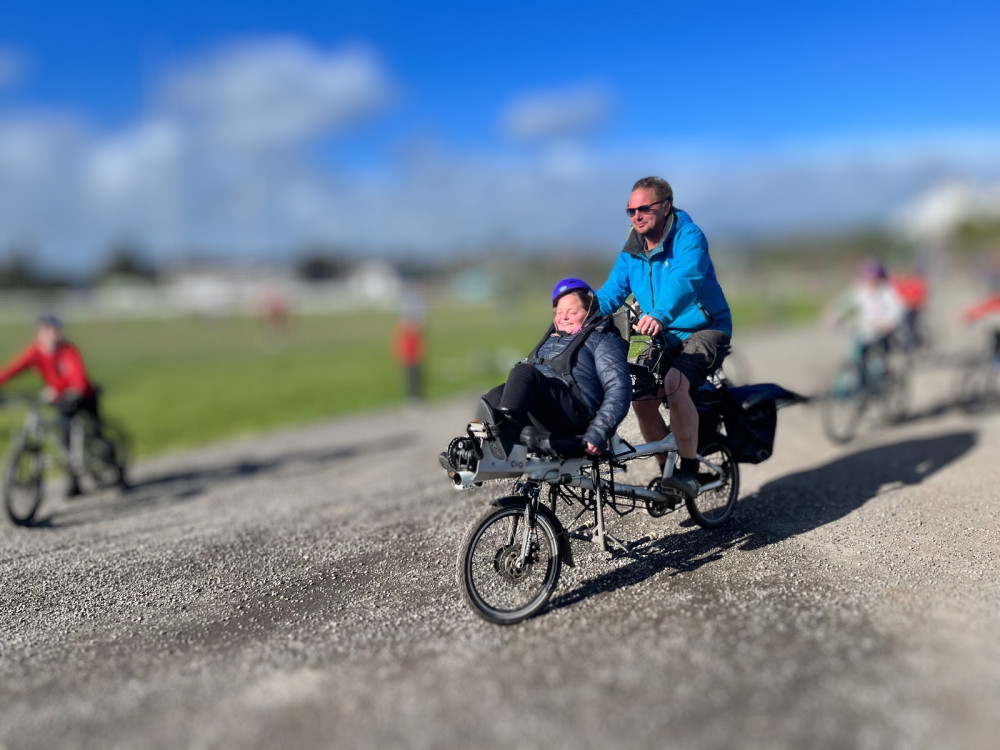 Rita and Mike taking part in a local sponsored cycle ride. (Image: Supplied) 