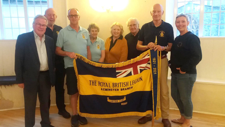 Members of the Axminster branch of the Royal British Legion with the new 100 year pennant, emblazoned with the Lister Cup award