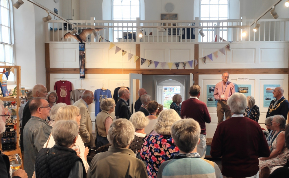 Trustee John West and the Mayor of Bridport, Cllr David Bolwell, present certificates to volunteers at West Bay Discovery Centre