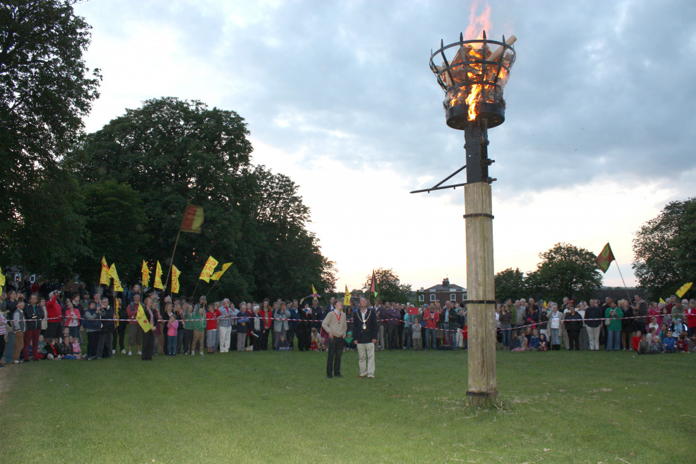 Dorchester’s town beacon in Salisbury Field, pictured in 2012 being lit by then mayor Andy Canning and son, James (photo credit: Trevor Bevins)