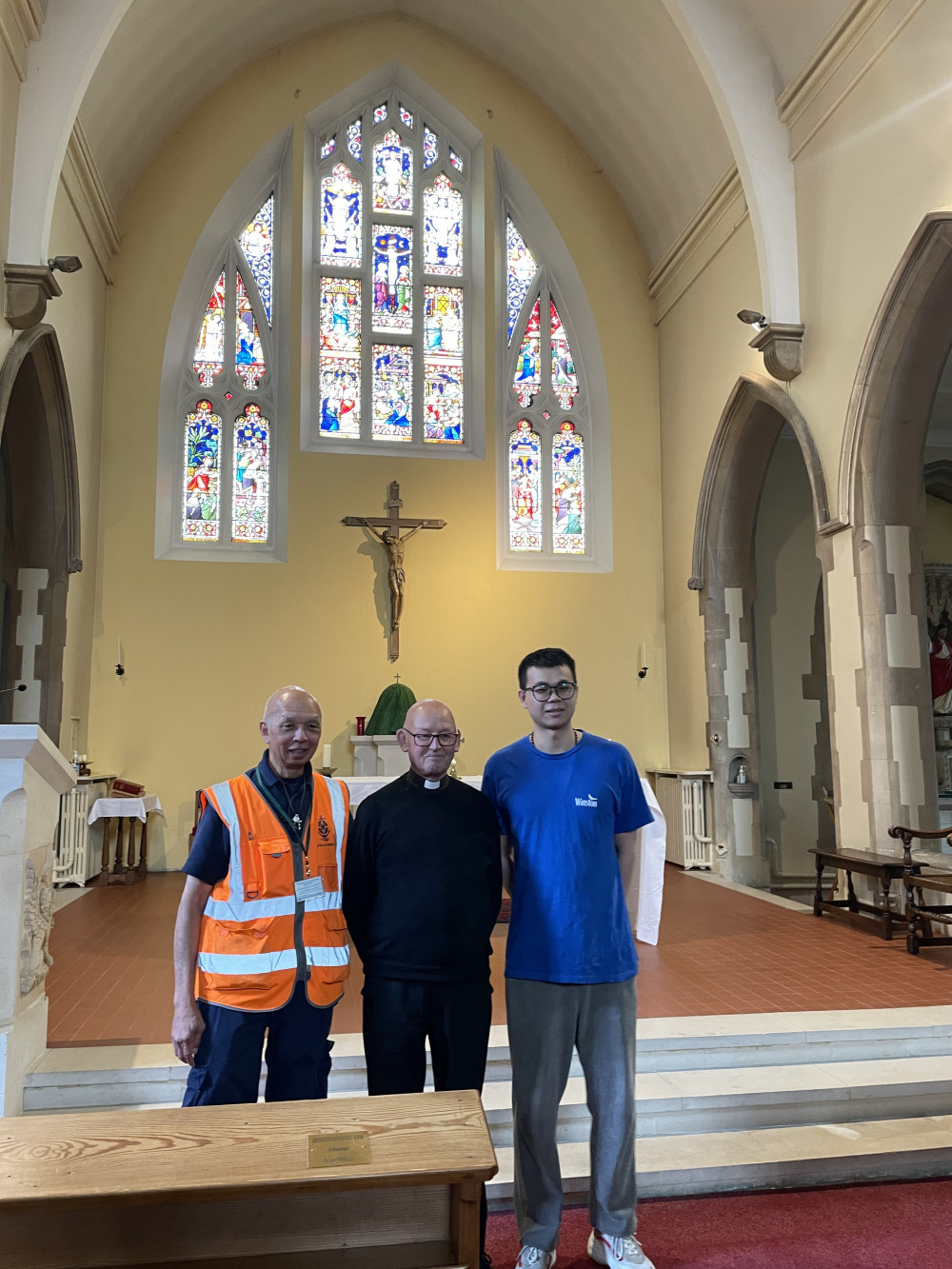 Julian Wong, left, Canon John Barnes, and Zhang in St Felix RC Church